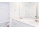Bathroom featuring double sinks with white quartz countertops and modern fixtures at 59 Davinhall Dr, Fuquay Varina, NC 27526