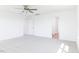 Spacious bedroom features neutral carpet, a ceiling fan, and natural light at 59 Davinhall Dr, Fuquay Varina, NC 27526