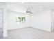 A bright bedroom with carpet, large windows, and ample closet space at 59 Davinhall Dr, Fuquay Varina, NC 27526