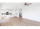 Open concept living room with wood-look flooring open to the kitchen at 59 Davinhall Dr, Fuquay Varina, NC 27526