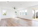 Bright and airy living room with large windows and hardwood floors perfect for entertaining at 59 Davinhall Dr, Fuquay Varina, NC 27526