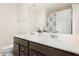 Bathroom featuring dual sinks, framed mirror, wood cabinets and decorative shower curtain at 728 Silo Park Dr, Wake Forest, NC 27587