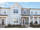 Charming two-story townhouse with a covered porch and neat landscaping at 728 Silo Park Dr, Wake Forest, NC 27587