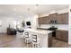 Eat-in kitchen featuring an island with bar stool seating, stainless appliances, and an open floor plan at 728 Silo Park Dr, Wake Forest, NC 27587