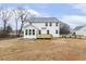 Rear view of a two-story home with a backyard and deck at 89 Jumper St, Wendell, NC 27591