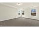 Large sunny bedroom with carpeted floor and several windows at 89 Jumper St, Wendell, NC 27591