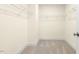 Walk in closet featuring wire shelving and neutral carpet with ample space at 89 Jumper St, Wendell, NC 27591