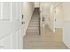 Inviting entryway with hardwood floors and a staircase leading to the upper level at 89 Jumper St, Wendell, NC 27591