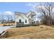 Attractive two-story home showcases white siding, stone accents, and a welcoming covered balcony at 89 Jumper St, Wendell, NC 27591