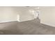 Upstairs landing area with cozy carpet, natural light, and white trim at 89 Jumper St, Wendell, NC 27591