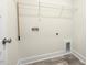 Well lit laundry room with vinyl flooring at 89 Jumper St, Wendell, NC 27591