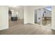Open-concept living space showcasing wood-look floors leading into the kitchen at 89 Jumper St, Wendell, NC 27591