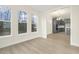 Bright living space with large windows, showcasing seamless flow to the kitchen at 89 Jumper St, Wendell, NC 27591