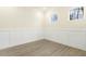 Bright office space featuring hardwood floors, wainscoting, and windows overlooking the yard at 89 Jumper St, Wendell, NC 27591