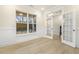 Versatile office space with hardwood floors, wainscoting, and glass French doors at 89 Jumper St, Wendell, NC 27591