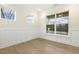 Well-lit office showcasing hardwood floors, wainscoting, and large windows with scenic views at 89 Jumper St, Wendell, NC 27591