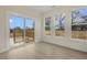 Bright sunroom with access to outdoor deck and large windows with scenic views at 89 Jumper St, Wendell, NC 27591