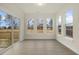 Sunroom with large windows and access to the deck, offering plenty of natural light at 89 Jumper St, Wendell, NC 27591
