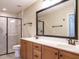 Bathroom boasts double sinks, a large mirror, and a walk-in shower at 992 Blue Bird Ln, Wake Forest, NC 27587