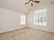 Bright bedroom with carpeted floors, ceiling fan, and plantation shutters at 992 Blue Bird Ln, Wake Forest, NC 27587