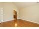 Hardwood floor bedroom with door to bathroom at 992 Blue Bird Ln, Wake Forest, NC 27587