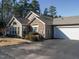 Exterior of charming ranch home with stone accents and a two-car garage at 992 Blue Bird Ln, Wake Forest, NC 27587