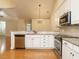Kitchen features granite countertops and stainless steel appliances at 992 Blue Bird Ln, Wake Forest, NC 27587
