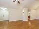 Hardwood floor living room with entryway and bathroom views at 992 Blue Bird Ln, Wake Forest, NC 27587