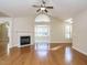 Open living room with hardwood floors, fireplace, and high ceilings at 992 Blue Bird Ln, Wake Forest, NC 27587