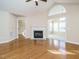 Living room features hardwood floors, fireplace, and sunroom access at 992 Blue Bird Ln, Wake Forest, NC 27587
