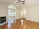Spacious living room with hardwood floors, fireplace and access to entryway at 992 Blue Bird Ln, Wake Forest, NC 27587