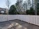 Private patio area with a white picket fence and spacious yard at 992 Blue Bird Ln, Wake Forest, NC 27587