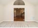 Sunroom with view into adjacent living area with hardwood floors at 992 Blue Bird Ln, Wake Forest, NC 27587