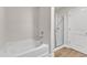 Bright bathroom with glass enclosed shower and soaking tub at 107 Wilderness Ct, Mebane, NC 27302