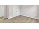 Bedroom features carpeting, white walls, white baseboards, and closet doors at 107 Wilderness Ct, Mebane, NC 27302