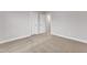 Bedroom with neutral carpet, white trim, light gray walls, and doors at 107 Wilderness Ct, Mebane, NC 27302