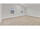 Spacious bedroom with neutral carpet, large windows, and abundant natural light at 107 Wilderness Ct, Mebane, NC 27302