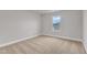 Bedroom with neutral carpet, gray walls, window, and white baseboards at 107 Wilderness Ct, Mebane, NC 27302