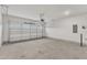 Spacious two car garage featuring concrete floors and white walls at 107 Wilderness Ct, Mebane, NC 27302