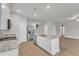 Modern open kitchen featuring an island with stainless steel appliances and white cabinets at 107 Wilderness Ct, Mebane, NC 27302