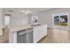 Spacious kitchen with a large granite island, stainless steel appliances, and views to the backyard at 107 Wilderness Ct, Mebane, NC 27302