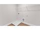 Laundry room with laminate flooring, wire shelving, and hookups at 107 Wilderness Ct, Mebane, NC 27302