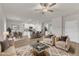 Open concept living room with modern furnishings that flows into the kitchen and dining area at 107 Wilderness Ct, Mebane, NC 27302