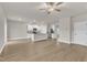 Spacious open-concept featuring kitchen view, and a large living area with luxury vinyl plank flooring at 107 Wilderness Ct, Mebane, NC 27302