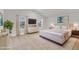 Spacious main bedroom features a vaulted ceiling, two windows, and neutral decor at 107 Wilderness Ct, Mebane, NC 27302