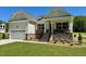Charming home exterior with stone accents, attached garage and manicured lawn at 19 Covey Rise Way, Lillington, NC 27546