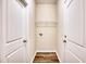 Laundry room with wire shelving and neutral walls at 19 Covey Rise Way, Lillington, NC 27546