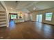 Open-concept living space with hardwood flooring and a kitchen view at 19 Covey Rise Way, Lillington, NC 27546