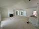 Open living room with fireplace and high ceilings at 19 Covey Rise Way, Lillington, NC 27546