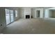 Living room with fireplace and patio access at 19 Covey Rise Way, Lillington, NC 27546